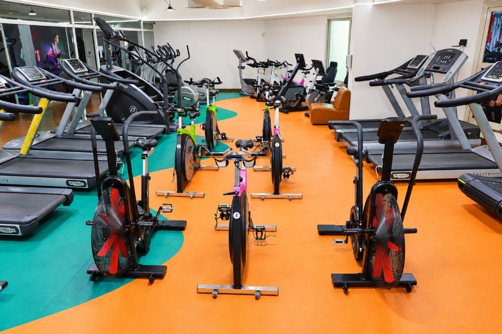 Spin bikes and treadmills on the Zarya gym floor