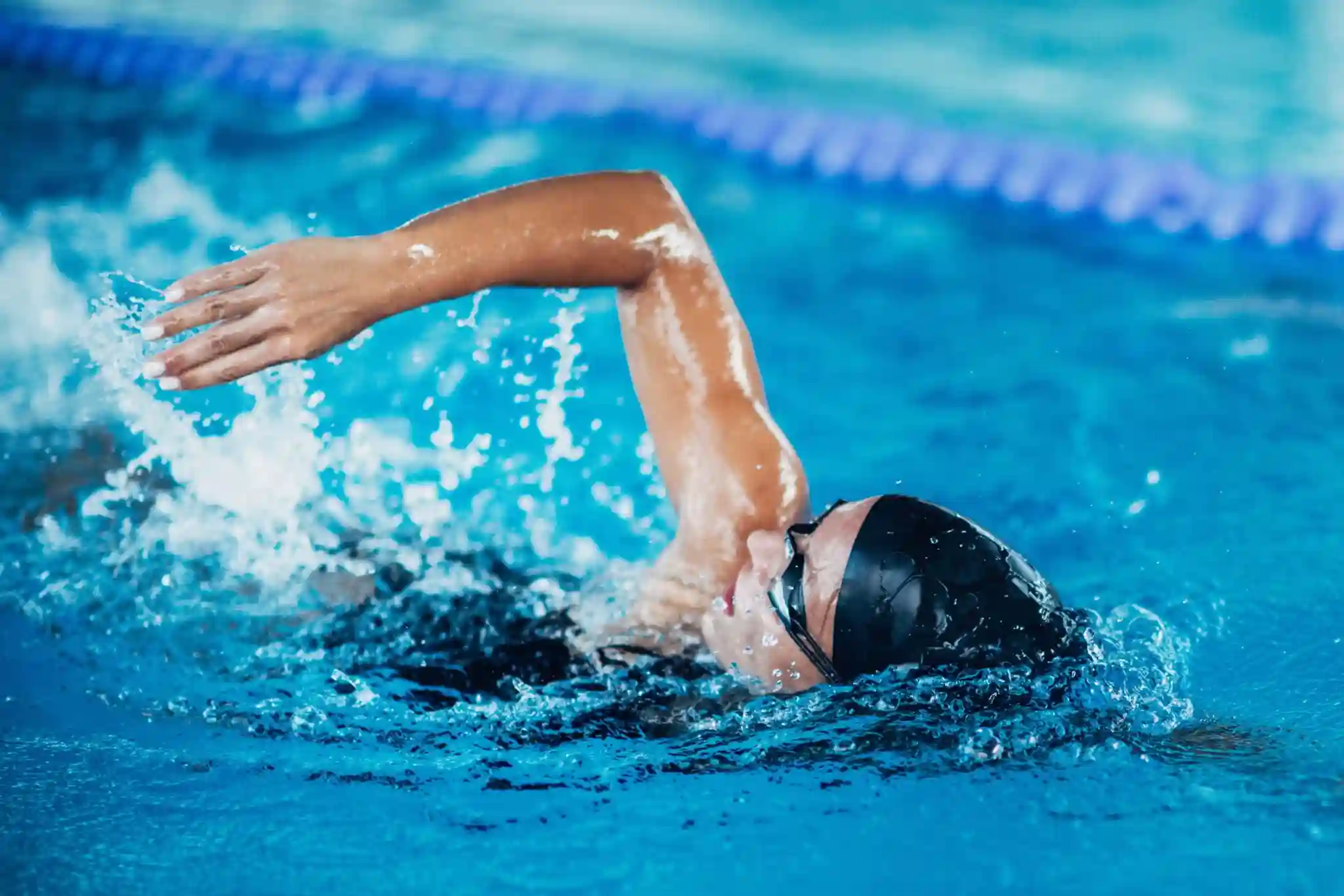 Swimmer doing freestyle in a swimming pool