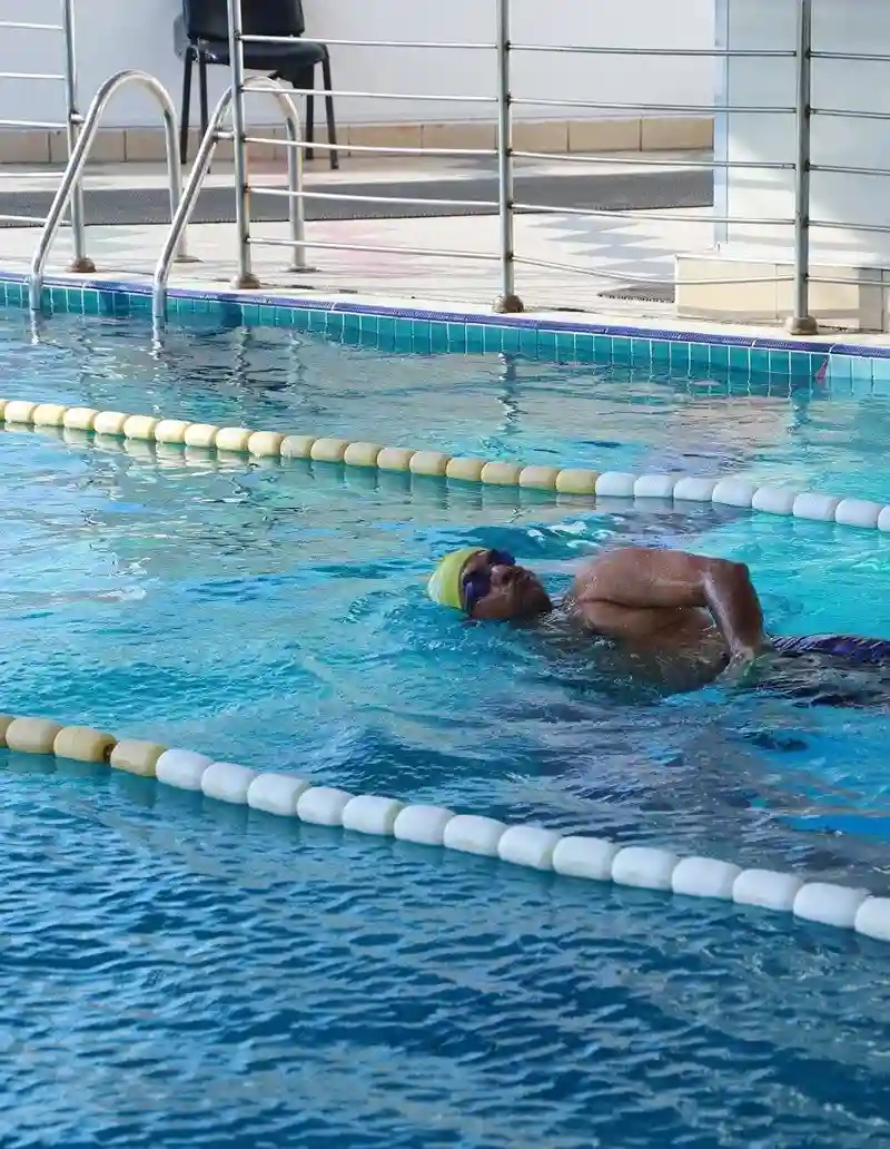 Swimmer doing laps in an indoor swimming pool